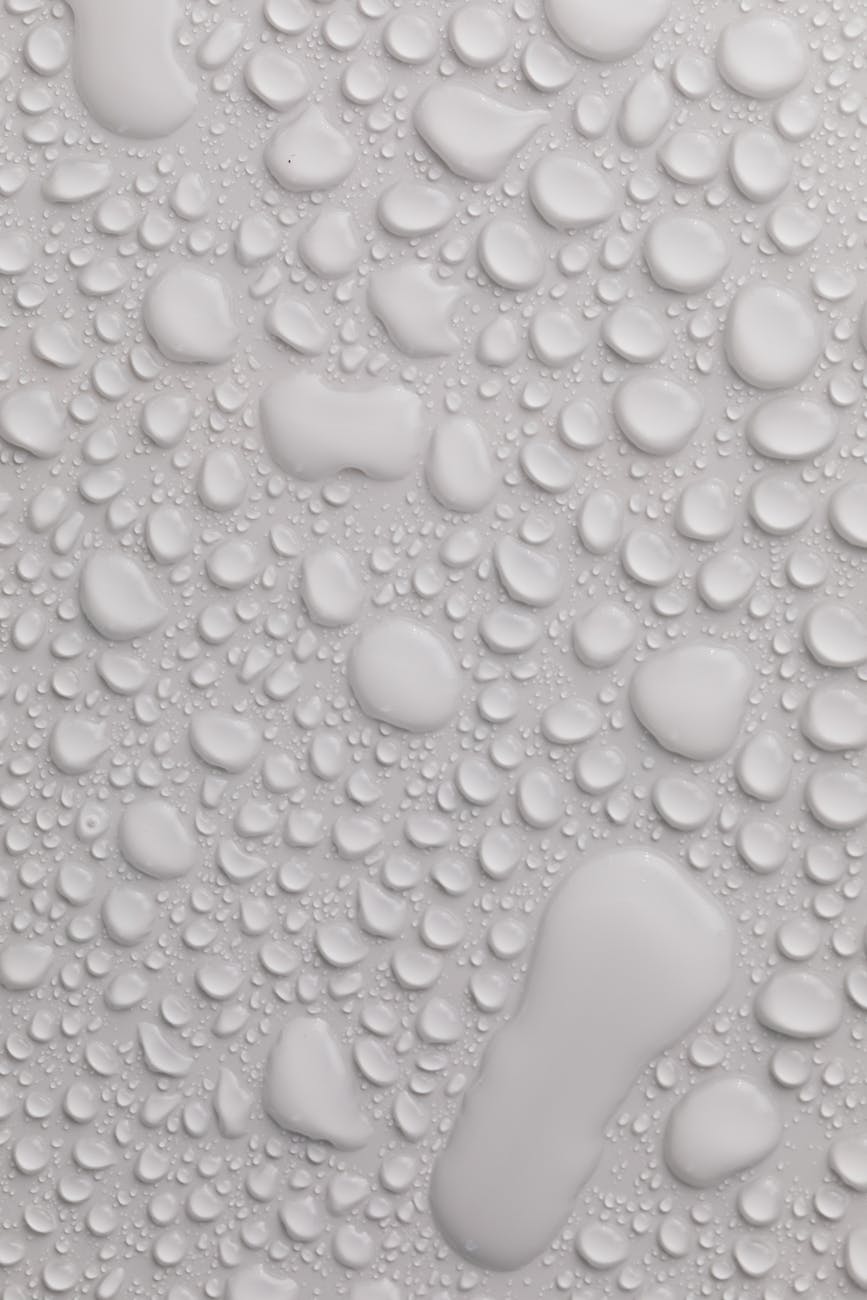 gray background with splattered water drops