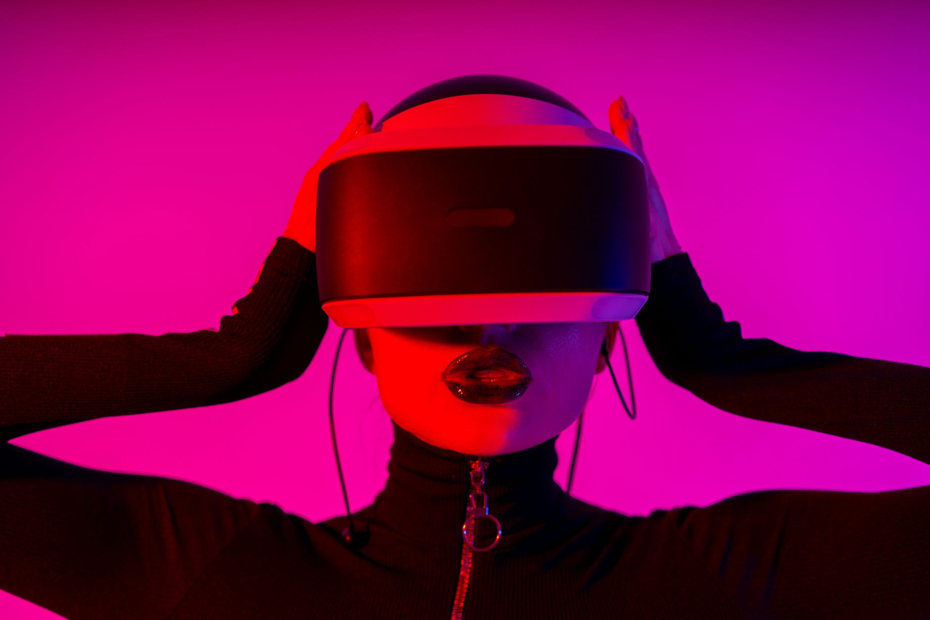 woman with bright lips interacting with vr headset